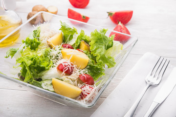salad with tomato, meat and potato