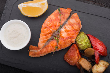 tasty salmon steak fish with grilled vegetables