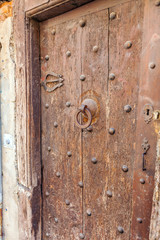 Fototapeta na wymiar Ancient Door with Handmade Knocker