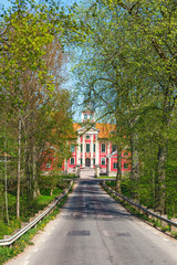 Avenue up to a castle in spring