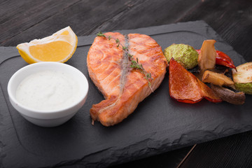 tasty salmon steak fish with grilled vegetables