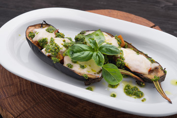 Baked eggplant with cheese and basil