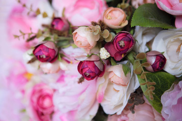 wedding bouquet with rose bush, Ranunculus asiaticus as a background
