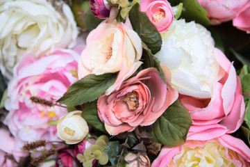 wedding bouquet with rose bush, Ranunculus asiaticus as a background
