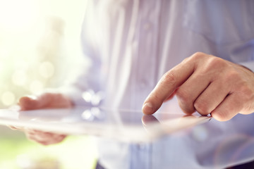Business man working on digital tablet