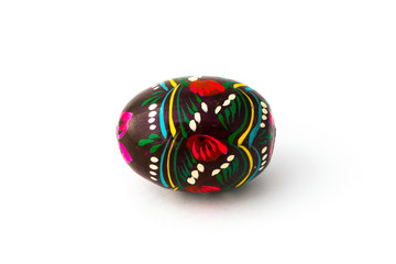 Wooden easter egg souvenir on white background