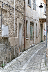 Vanishing street with vintage buildings. Pano Lefkara, Cyprus.
