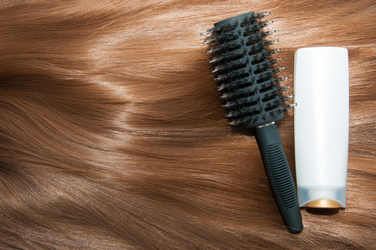 Long brown straight hair with comb and shampoo