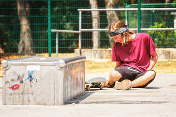 teenage boy with skateboard in the skate park
