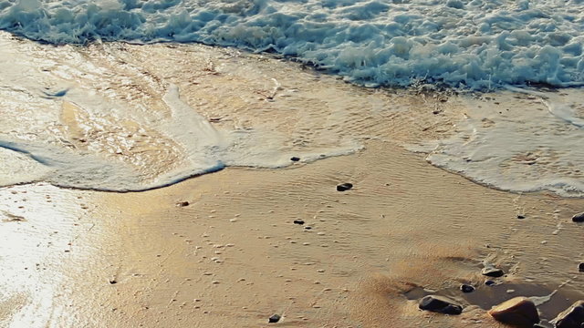 Video 1920x1080 - Soft foaming waves pouring sandy beach on a bright sunny day