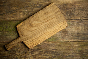 Rustic kitchen board on wooden background