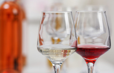 Wine glasses with red and white wine, closeup