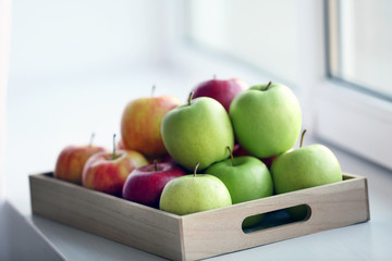 Ripe apples on windowsill