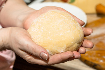 chef holds a finished dough