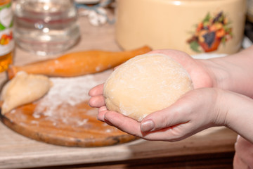 finished dough in the hands of chefs
