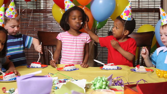 Children eating birthday cake