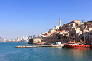 Fototapeta premium Old port of Jaffa with Tel Aviv's skyline in the background