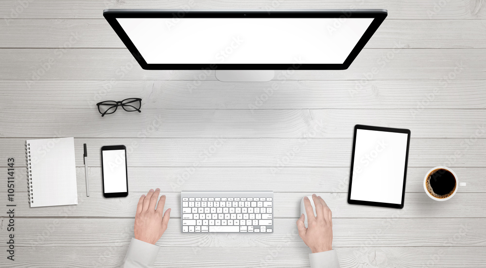 Poster Responsive devices with isolated screen for mockup. Top view of modern desk with computer display, phone and tablet. Keyboard, coffee, glasses, notebook, pencil on table.