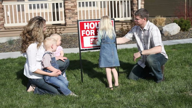 Family puts up SOLD sign in front of home