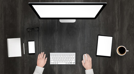 Responsive devices with isolated screen for mockup. Top view of modern desk with computer display,...