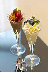 Chocolate and vanilla ice cream served on a table in hotel room