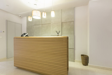 Wooden reception desk in spa center