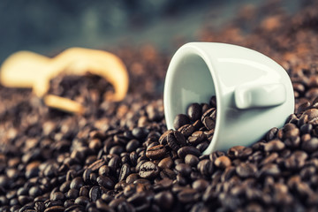 Coffee. Coffee beans. Coffee cup full of coffee beans. Toned image.