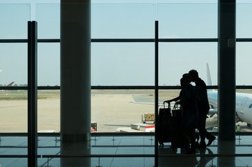 Silhouette walking in termanal airport