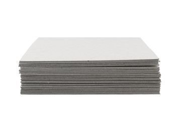 close-up of stack gray cardboard on white background