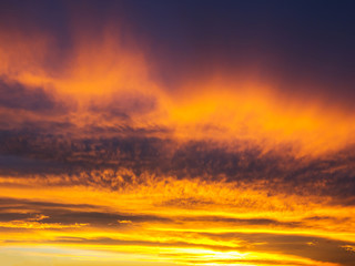Fototapeta premium Blue and yellow stripes sky and clouds at sunset - pattern