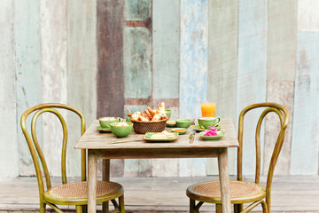 Breakfast in the garden with coffee and a simple food. Good mood