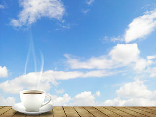 Hot Coffee cup on wood floor and sky