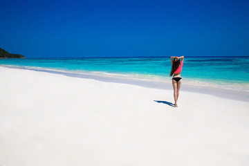 Fototapeta na wymiar Free Happy Woman Enjoying tropical beach nature. Wellness. Trave