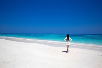 Fototapeta na wymiar Free Happy Woman Enjoying tropical beach, girl walking on exotic
