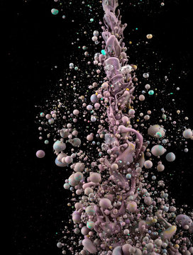 Photographs of oil drops creating bubbles. A detailed colorul abstract design isolated on black background. Liquid colors mixing in dynamic flow. 
