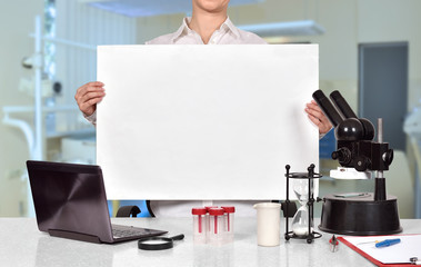 scientific researcher holding blank placard