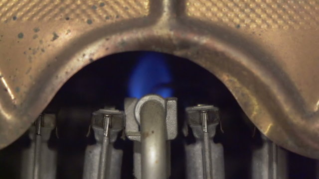 gas water heater. The ignition torch is lit, then the main flame joins. Slow motion