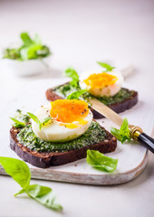 Boiled egg with pesto on toast