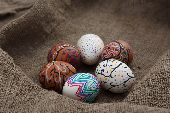 Colored Easter eggs on burlap