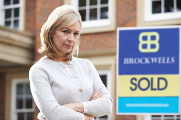 Fototapeta premium Mature Woman Forced To Sell Home Through Financial Problems