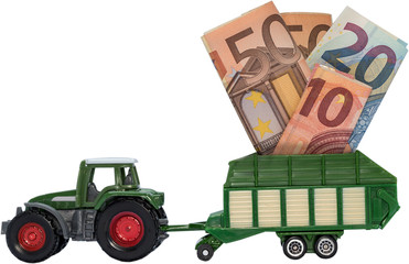 Traktor mit Anhänger voll Geld