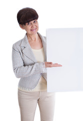 Mature woman leaning on white banner. Portrait against of white background