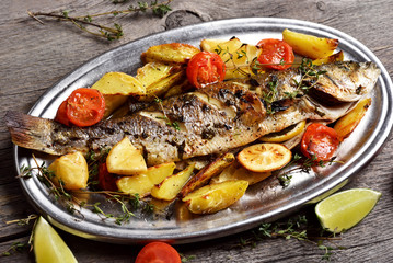 Grilled fish with baked potato wedges
