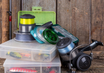 fishing tackles, lures and baits in boxes