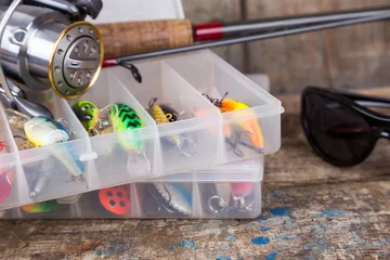 Foto op Aluminium fishing tackles, lures and baits in boxes © sytnik