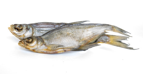 Two dried fish on white background