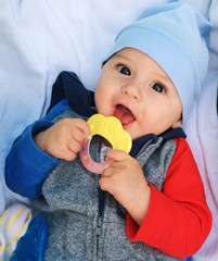 happy baby with his teether