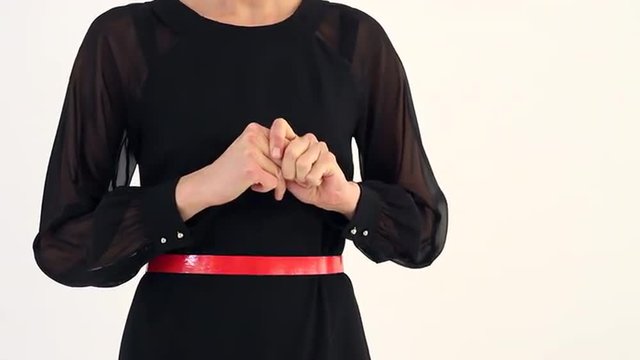 Teacher, Manager, Seller, Attorney in the Stress/Woman nervously shaking hands. It can be a lawyer, accountant, insurance agent, a manager, a teacher, a housewife. She in black dress with a red strap