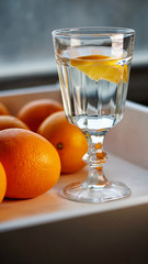 glass of water with a slice of orange