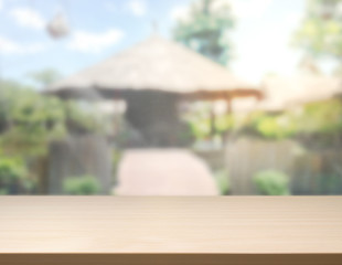 Fototapeta premium Table Top And Blur Building Of Background
